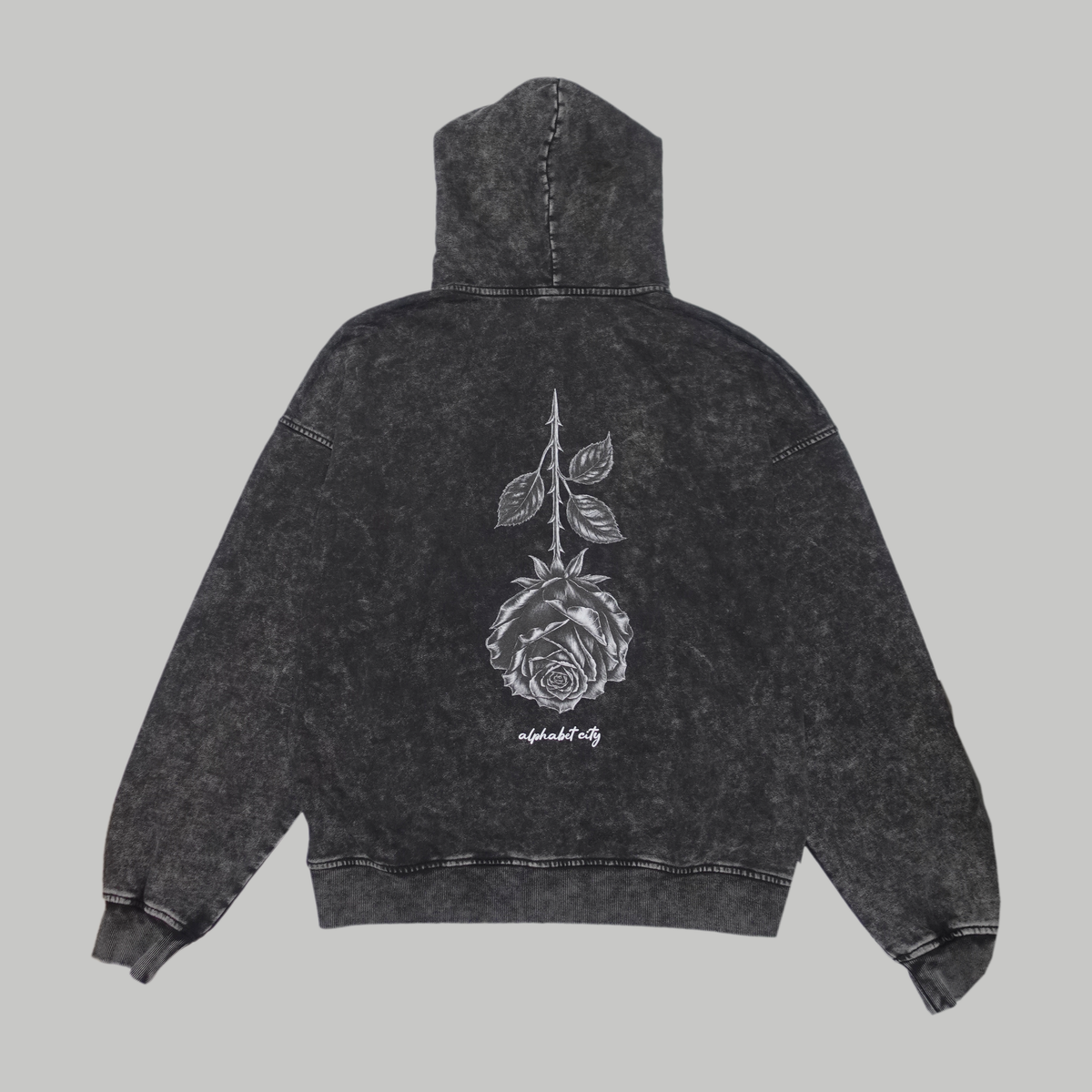 Back photograph of the BLACK ROSE Hoodie, showing the large inverted rose and ALPHABET CITY lettering.