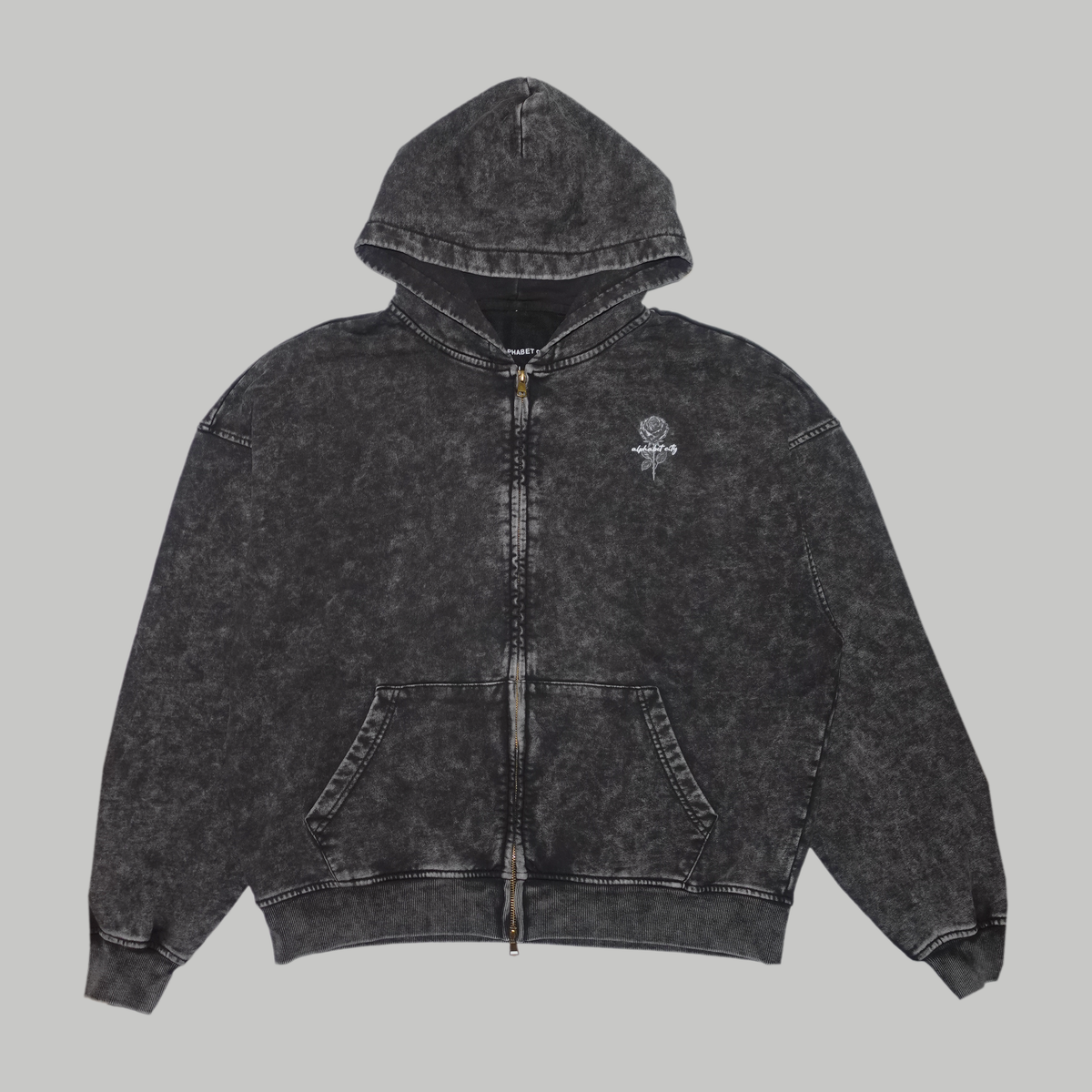 Front photograph of the BLACK ROSE Hoodie in Faded Black, showing the full zip, small chest rose, pockets and oversized shape.