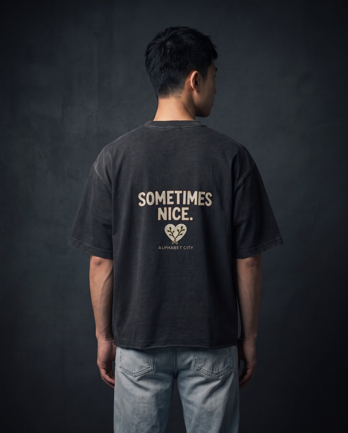 Model wearing the Good&Bad Cotton Tee in Faded Black, back view