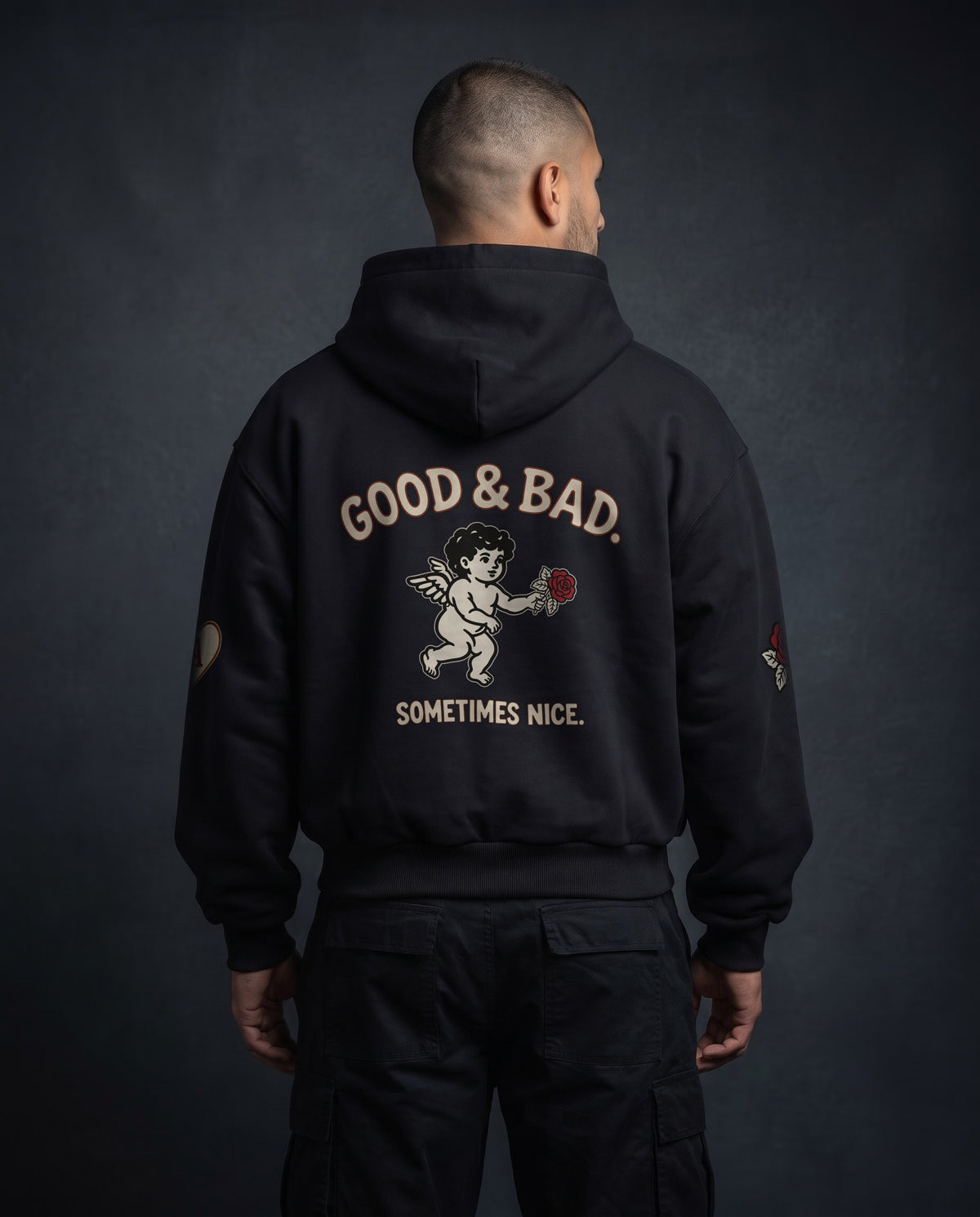 Model wearing the Good&Bad Zip Hoodie in Black, back view