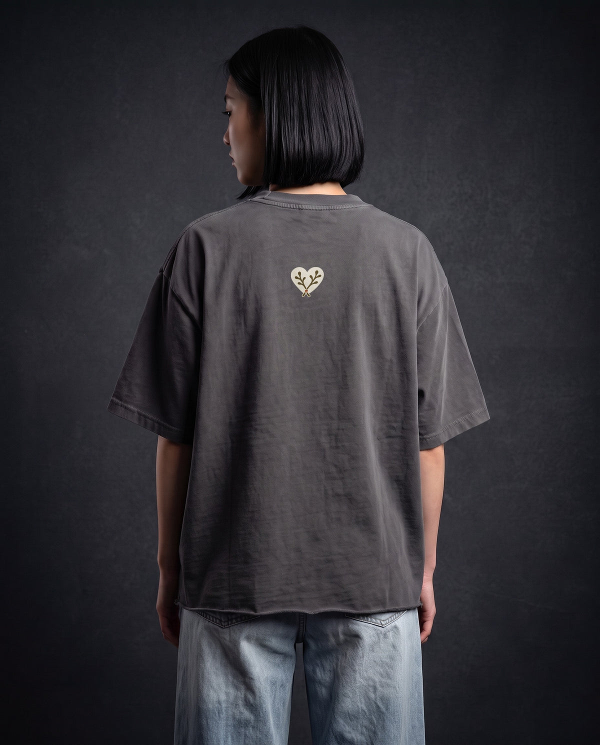 Model wearing the Heart Cotton Tee in Dark Gray, back view