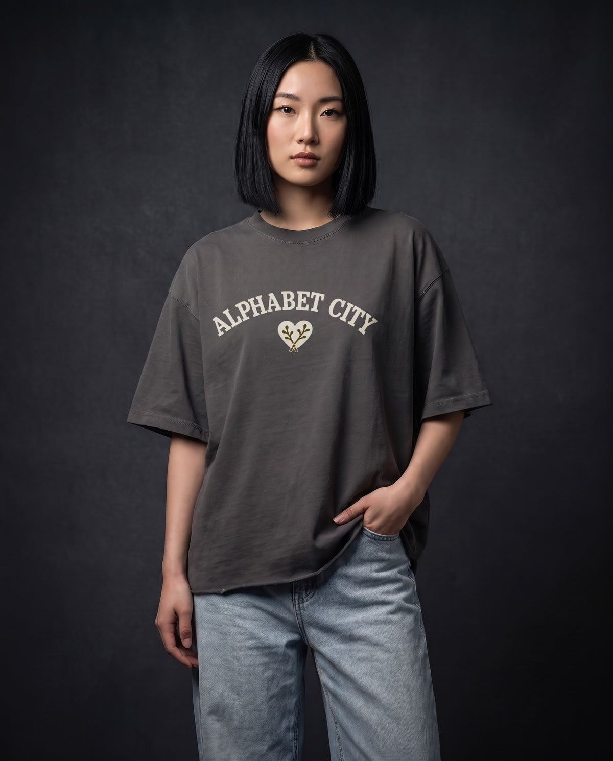 Model wearing the Heart Cotton Tee in Dark Gray, front view