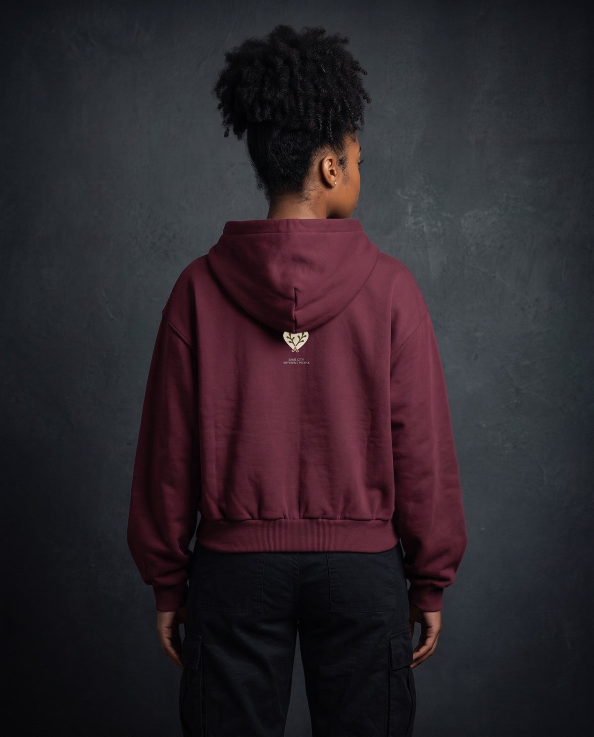 Model wearing the Heart Zip Hoodie in Red, back view