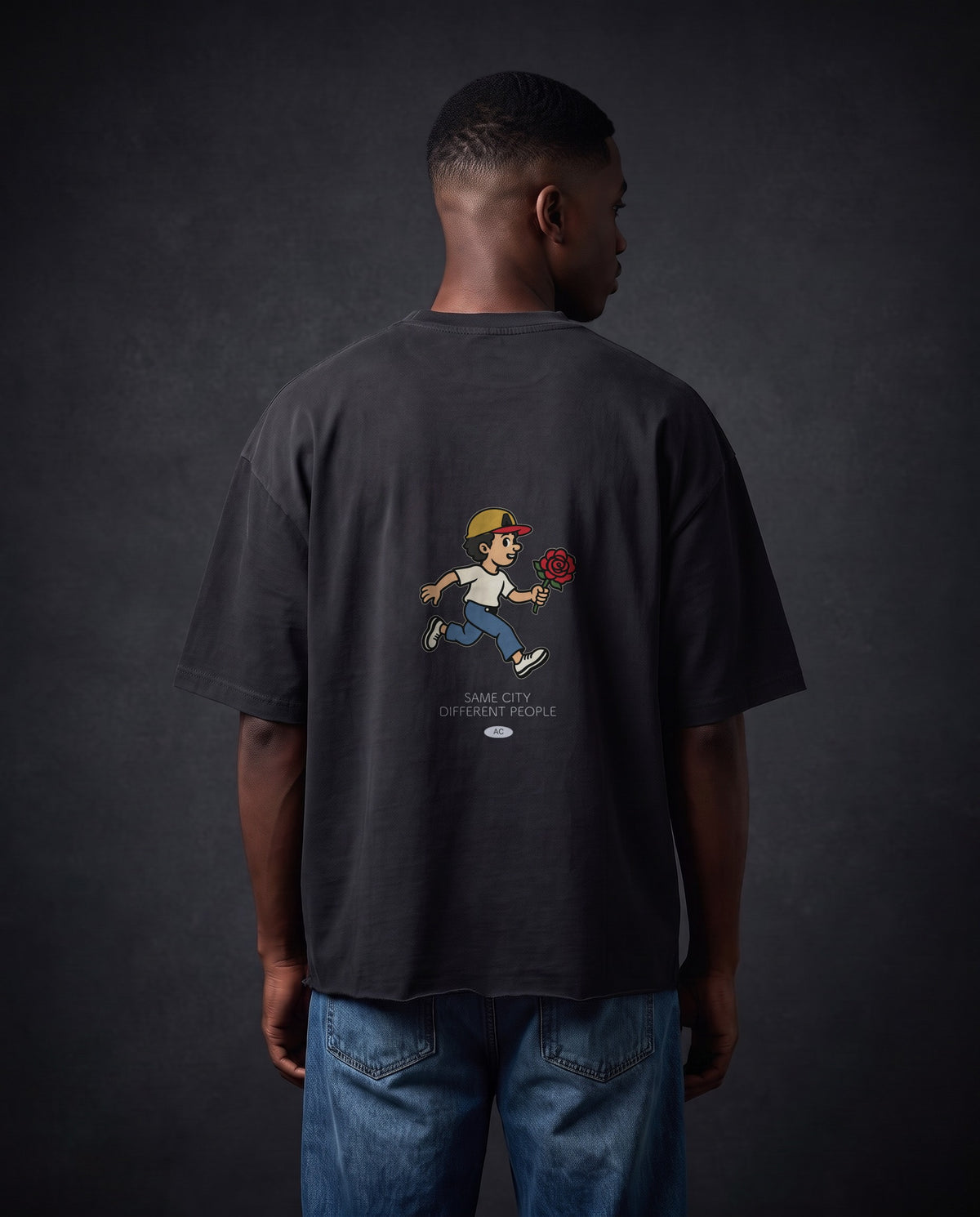 Model wearing the Rose Runner Cotton Tee in Faded Black, back view