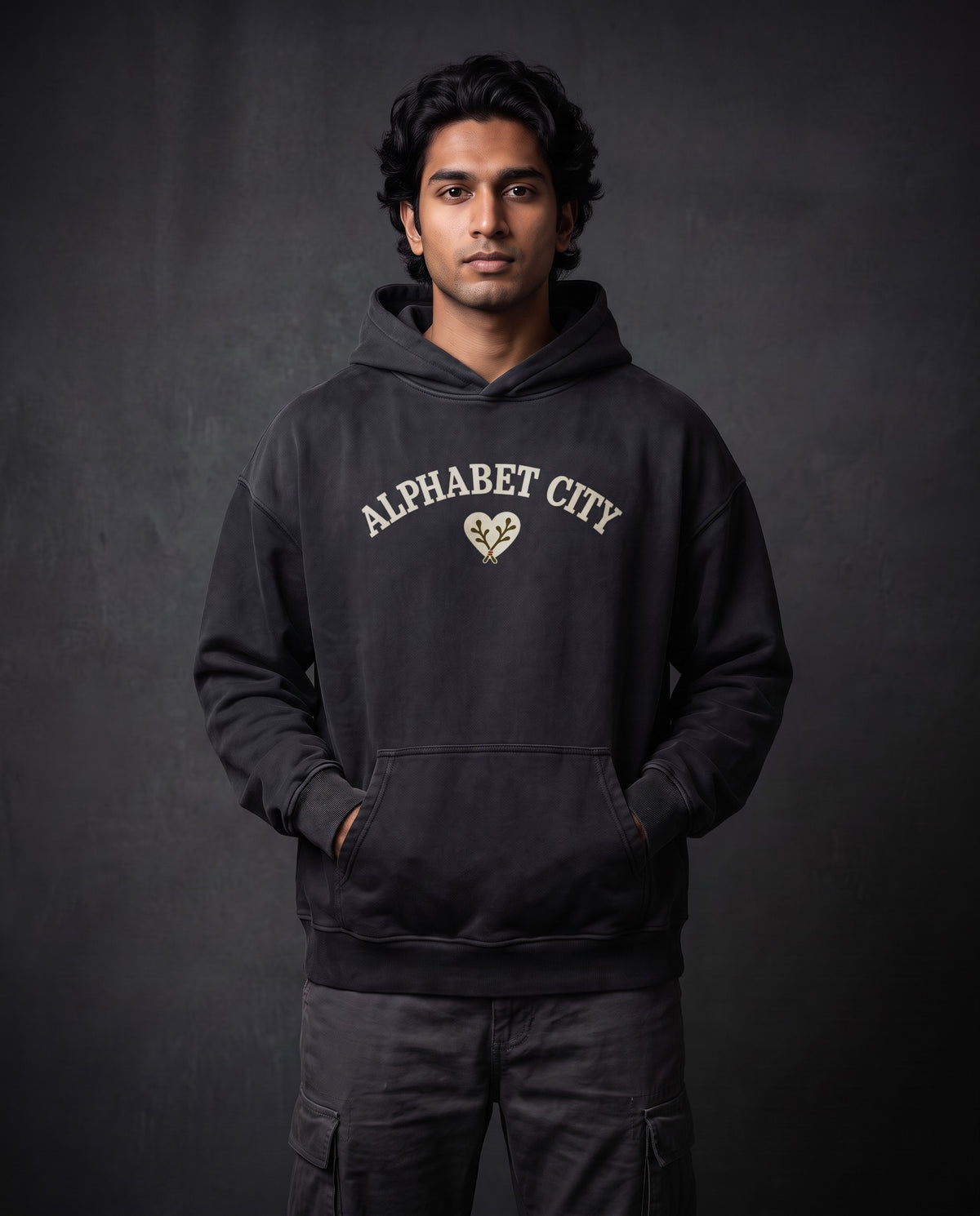 Model wearing the Rose Runner Heavyweight Pullover Hoodie in Faded Black, front view